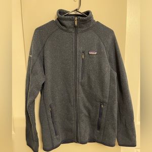 Patagonia zip up navy jacket with “Kirkland and Ellis” law firm brand.